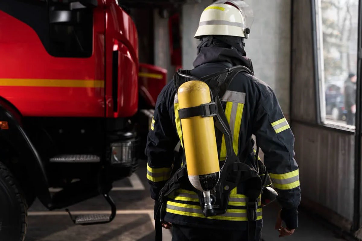Fire watch guard looking at firetruck.